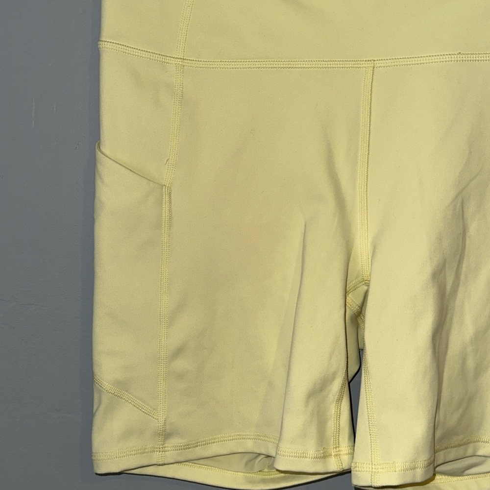 Fabletics Pale Yellow Bike Shorts with Side Pockets - Picture 2 of 6